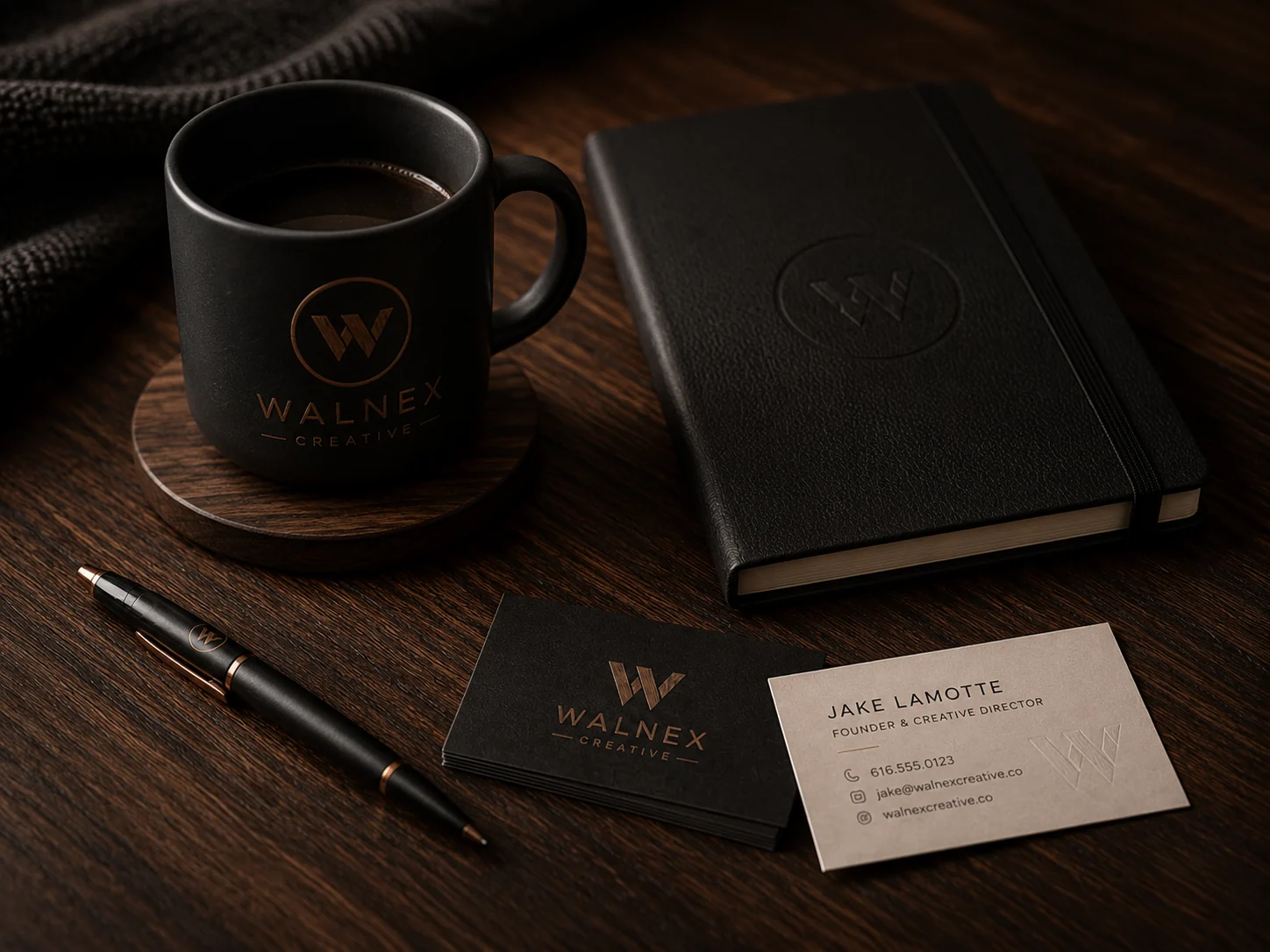 Walnex branded touchpoint kit with mug, notebook, pen, and business cards